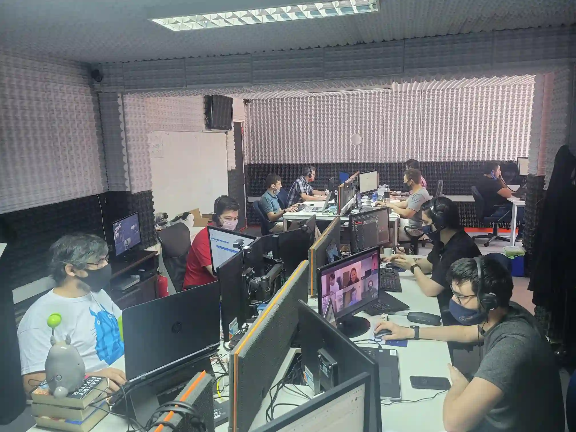 CIO Landing employees working on computers in office setting.